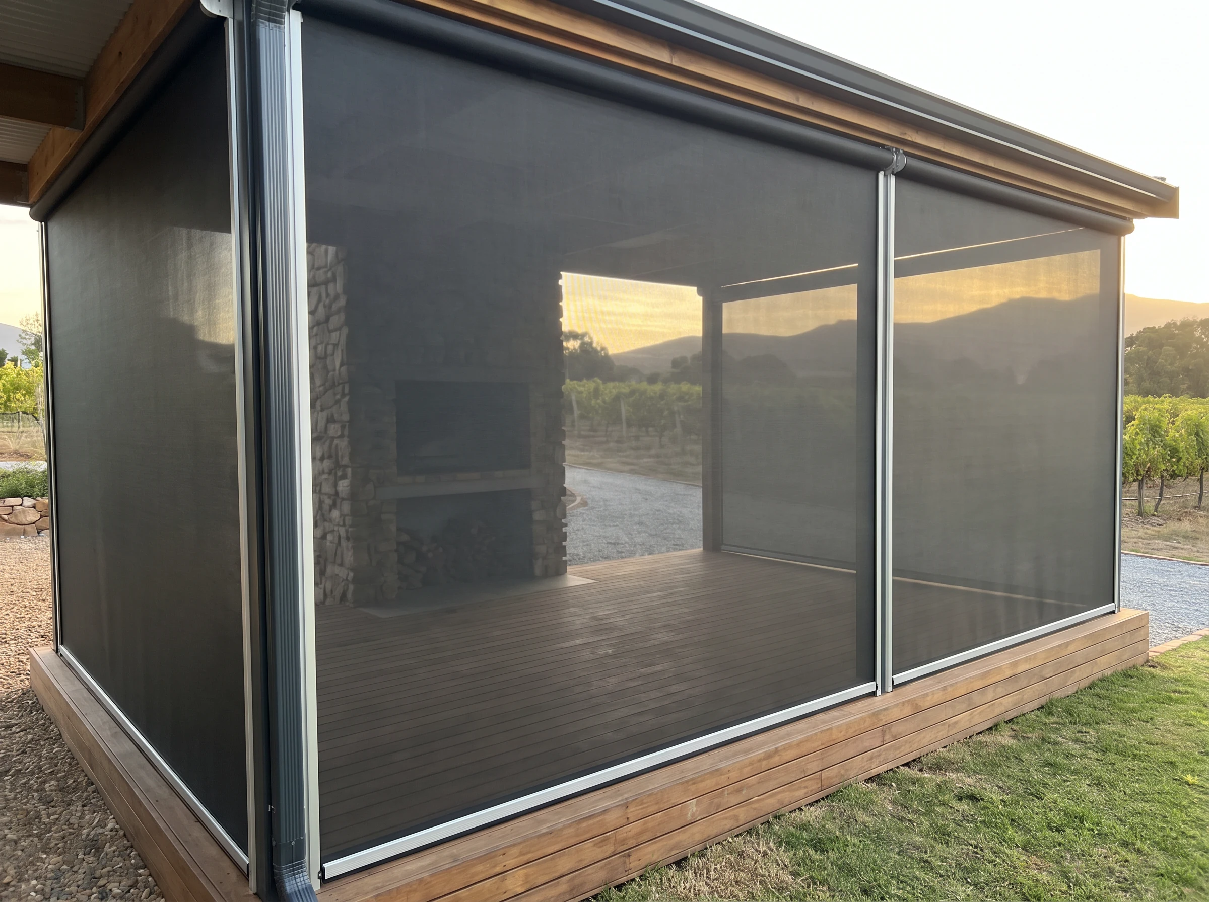 Zip-track outdoor screen enclosing a braai entertainment deck near Klapmuts against the evening wind
